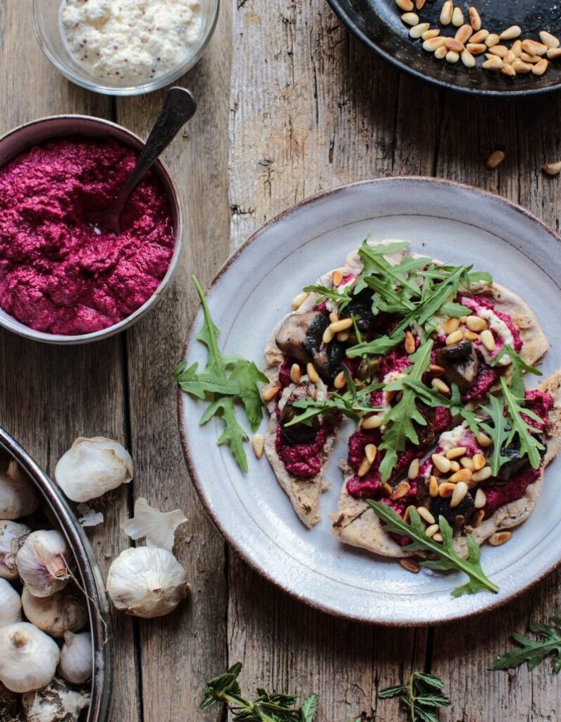 Buckwheat flatbread pizza with beetroot hummus and cashew cheese