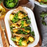 Crispy coconut cauliflower with minty peas & pita
