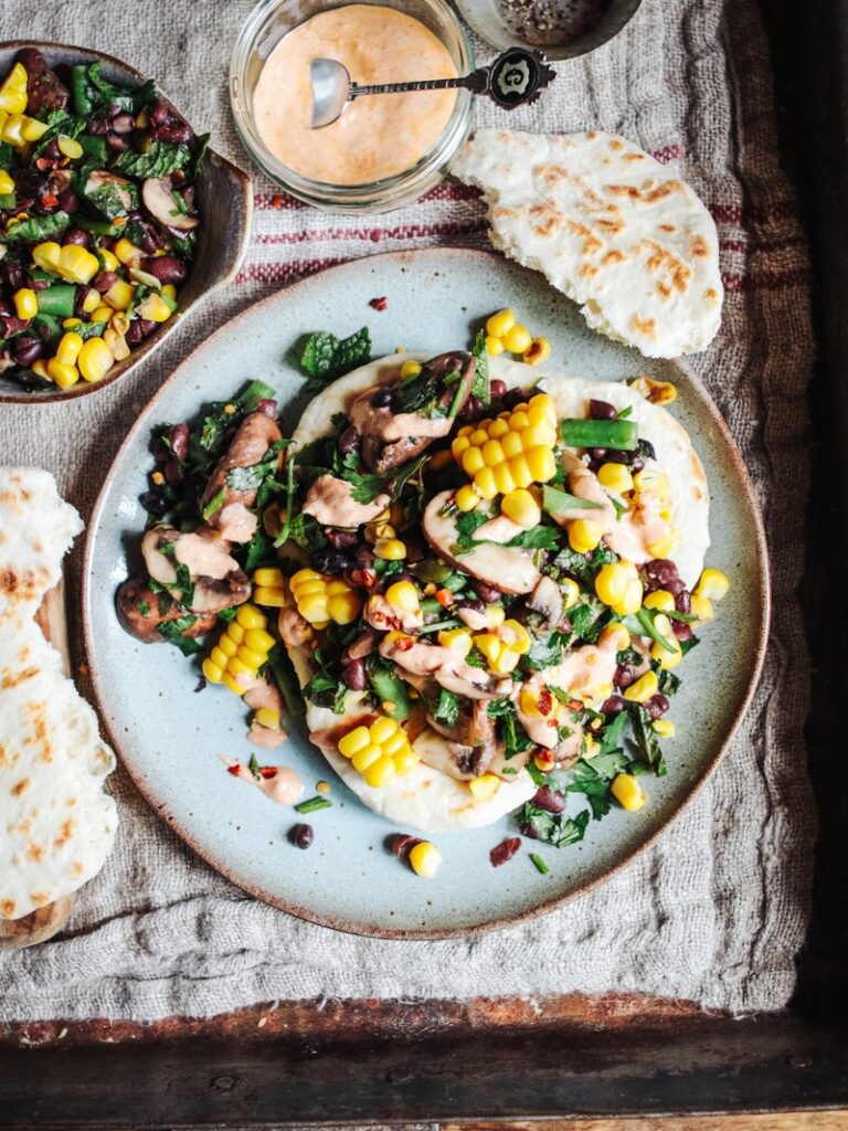 Fresh corn & black bean salad with harissa, hummus and flatbread