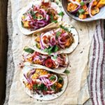 Harissa sweet potato tacos with baba ganoush and pickled onions