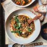 Hearty puy lentil stew on creamy hummus