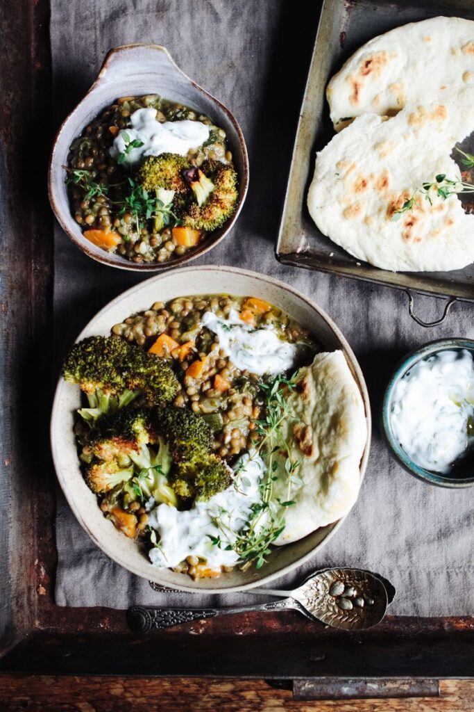 Herby spinach lentil stew with broccoli steaks and spelt flatbreads