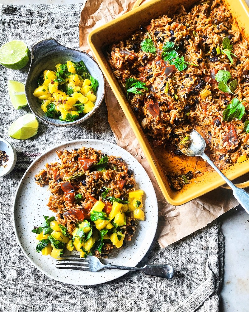 baked-mexican-rice-with-beans-and-greens-topped-with-mango-salsa 1