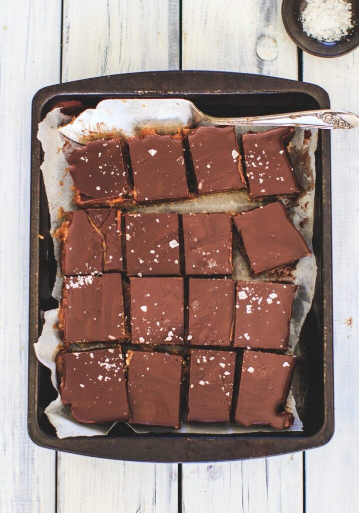 Indulgent caramel millionaires shortbread slices with ombar chocolate (gluten free)
