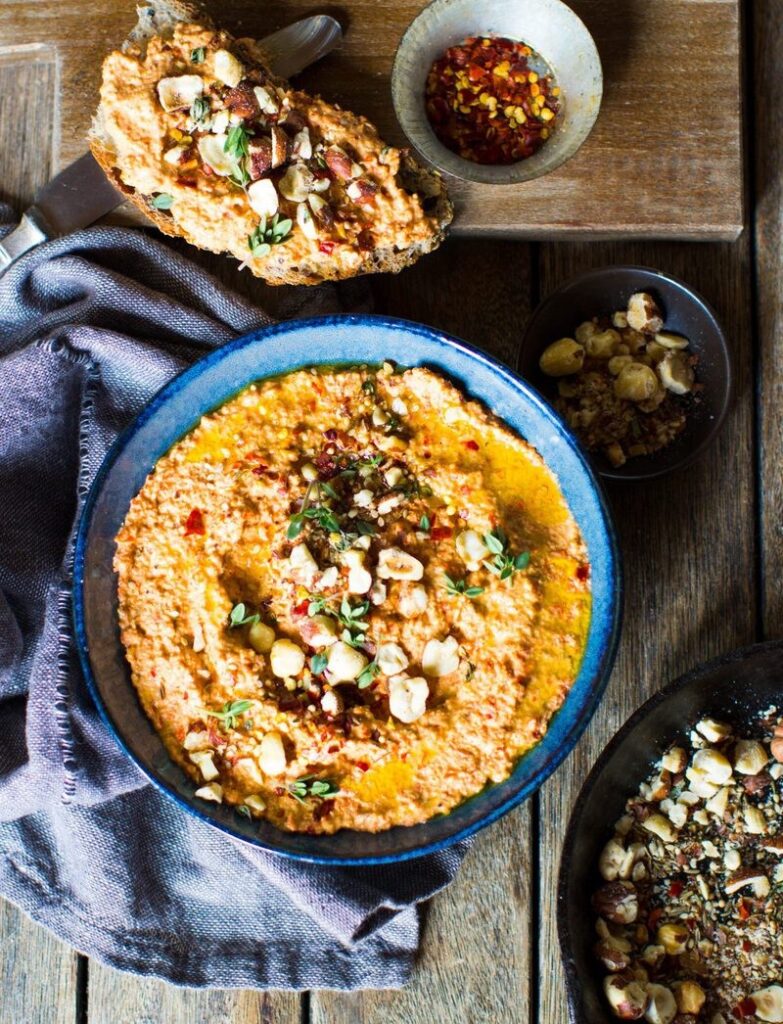 Roast carrot, squash and potato salad with creamy muhammara and dukkah