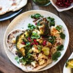 Roast cauliflower & broccoli with crushed celeriac, aubergine dip, herby caper dressing & flatbread