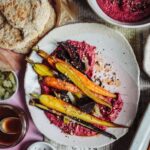 Roast rainbow carrots & beetroots with beetroot walnut hummus & gomashio