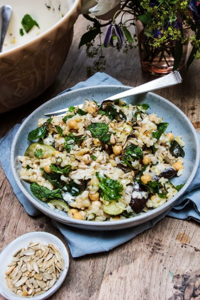 Roast veg, chickpea & rice salad with tahini dressing and toasted seeds