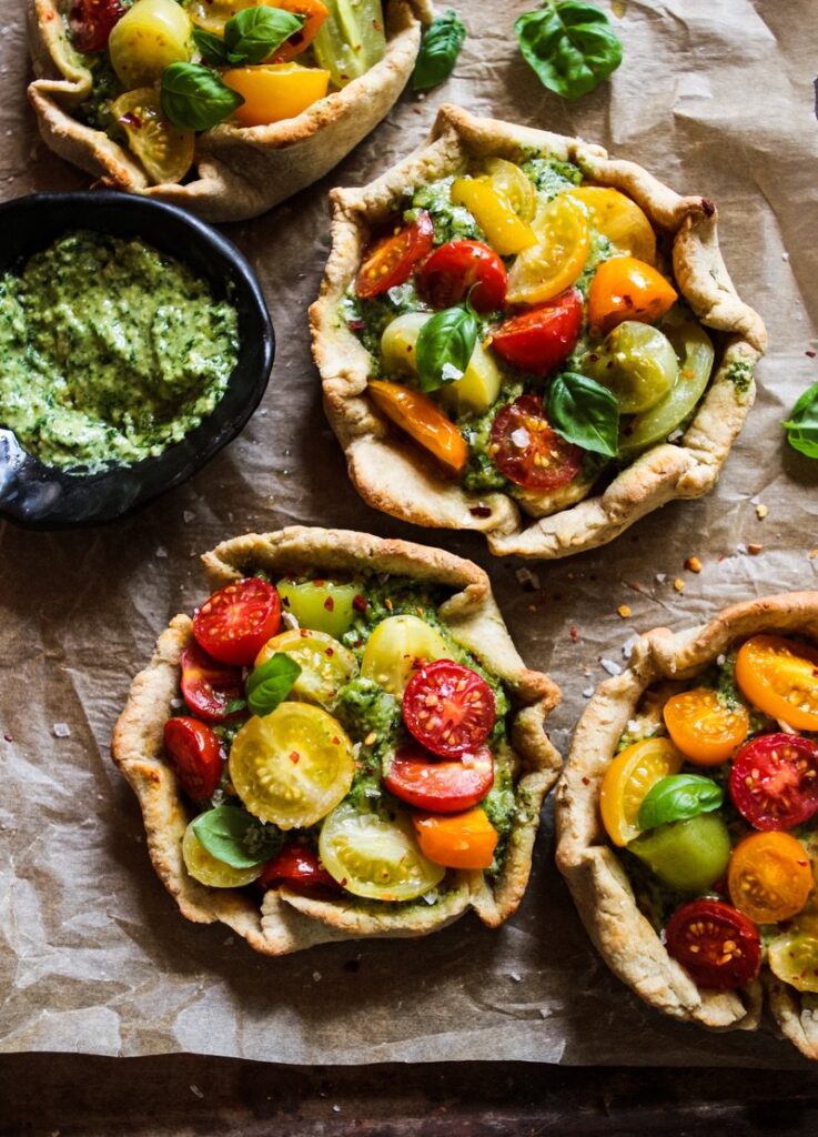 Rustic cherry tomato, cashew cheese & pesto tarts