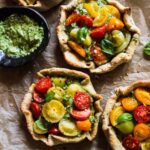 Rustic cherry tomato, cashew cheese & pesto tarts