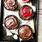 Salted caramel choc tarts with raspberry coulis