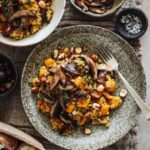Squash and mushroom pearl barley risotto with truffle oil and toasted hazelnuts