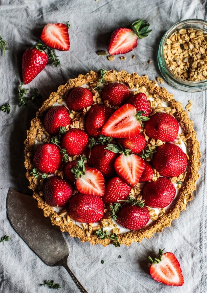 Strawberry coconut cream tart with a crispy oat crust