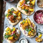Tandoori cauliflower mini pizzas with mint sauce & pickled onions