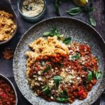 The best lentil bolognese with roast veg mash and cashew parmesan