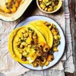 Turmeric gram flour crepes with spiced butterbeans and roast yellow courgette and tomatoes