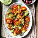Roast tomato, crushed potato and pesto salad